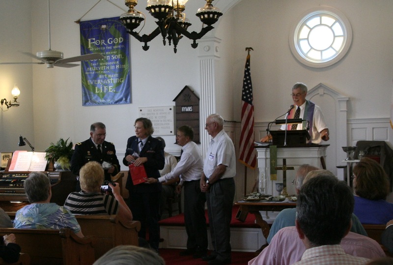Maj. Gen. Frank Vavala, adjutant general of the Delaware National Guard, receives a wooden cutout of Coolspring Presbyterian Church from the Rev. Susannah Tulloch, church pastor. Tulloch is a Delaware Air National Guard captain and chaplain. “What do you give a general who already has everything?” Tulloch asked before giving Vavala the cutout. BY HENRY J. EVANS JR.
